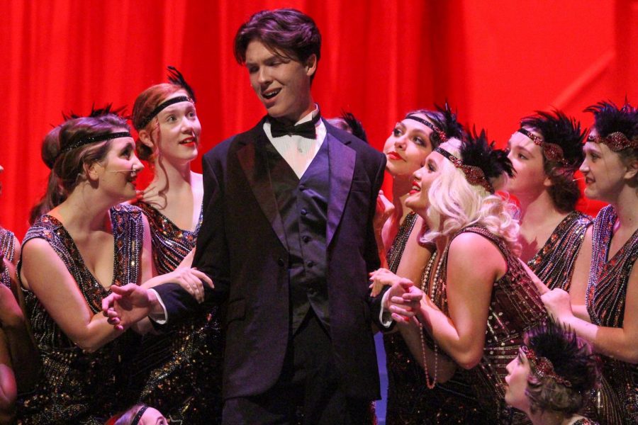 Jimmy Winter (played by senior Logan Lowery) is surrounded by chorus girls during one of Melissa Theatres performances of Nice Work If You Can Get It.