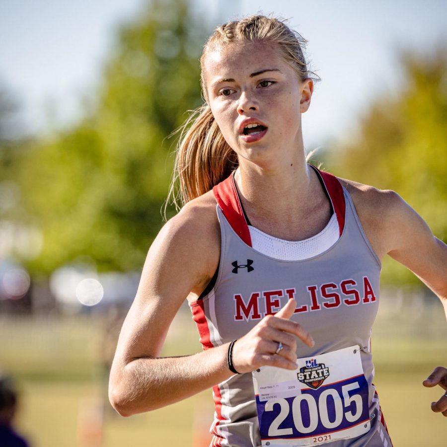 Abigail Bass races in the UIL 4A State Cross Country Meet.