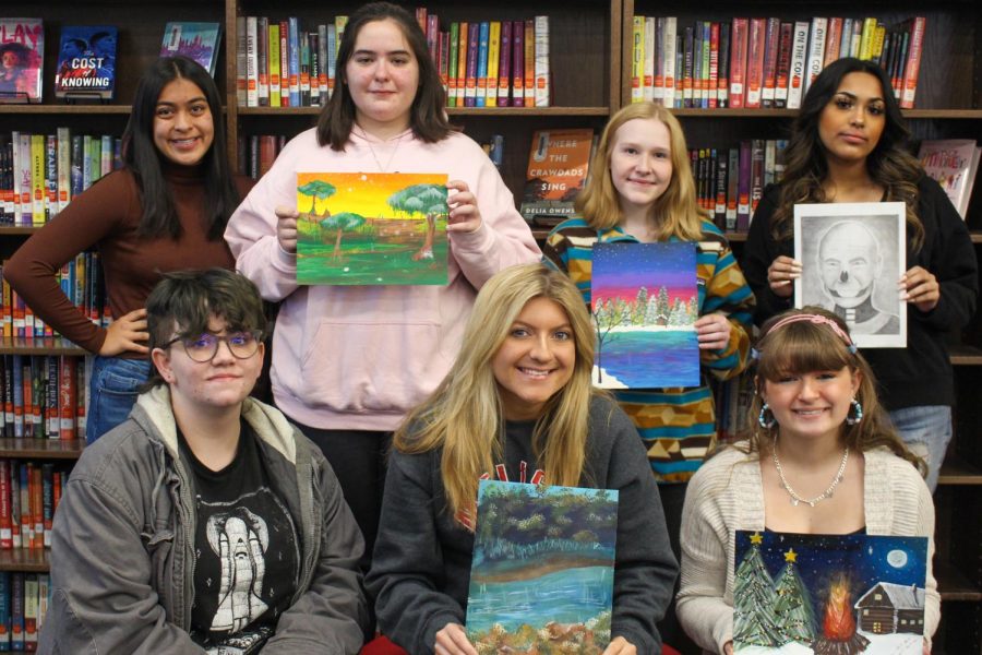 Students pose with their Celebrating Art winning pieces. Front row: Jillian Walter, Jaelyn Strohl, and Phoenix Anderson. Back row: Jade Gonzales, Sofia Perez, Brogan Middleton, and Elizabeth Franco. Not pictured: Riley Hefel.