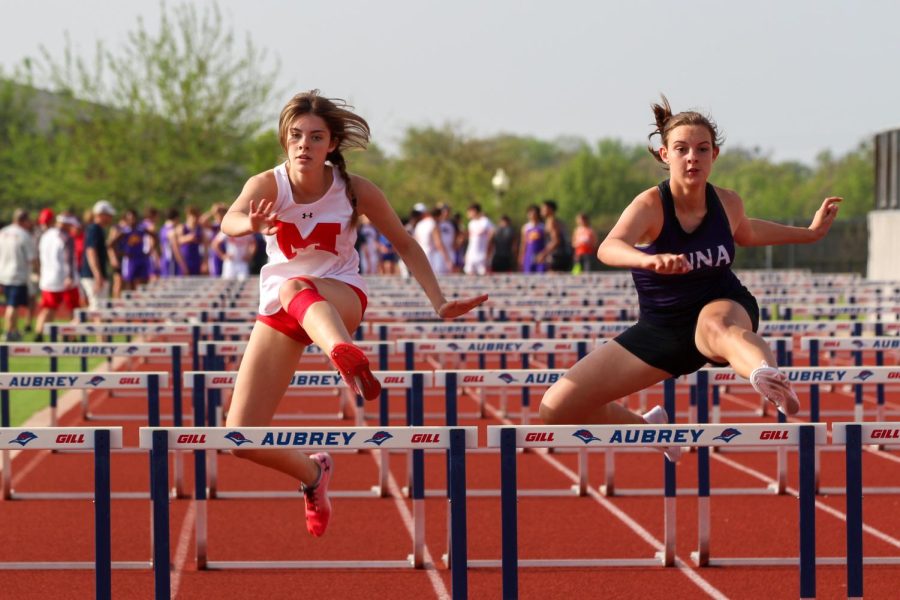 Junior Ashlynn Elias competes in the 100m hurdles at the district track meet in Aubrey on April 13.
