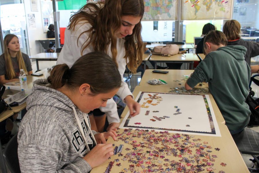 Students assemble puzzles during a Mega Lunch club during the 2021-22 school year.
