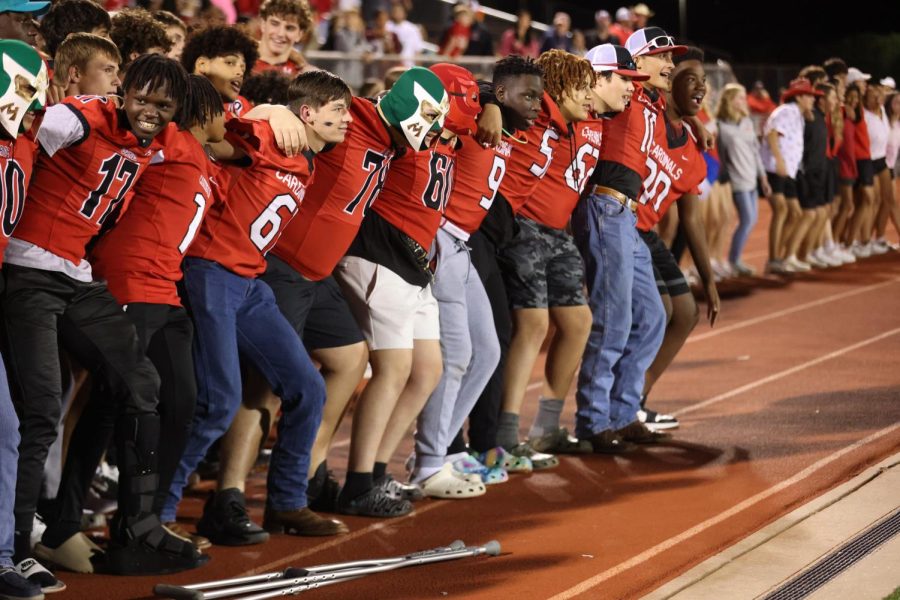 The varsity football players along with the Melissa community perform the Big Boom at the homecoming pep rally held Oct. 26 at Cardinal Stadium.