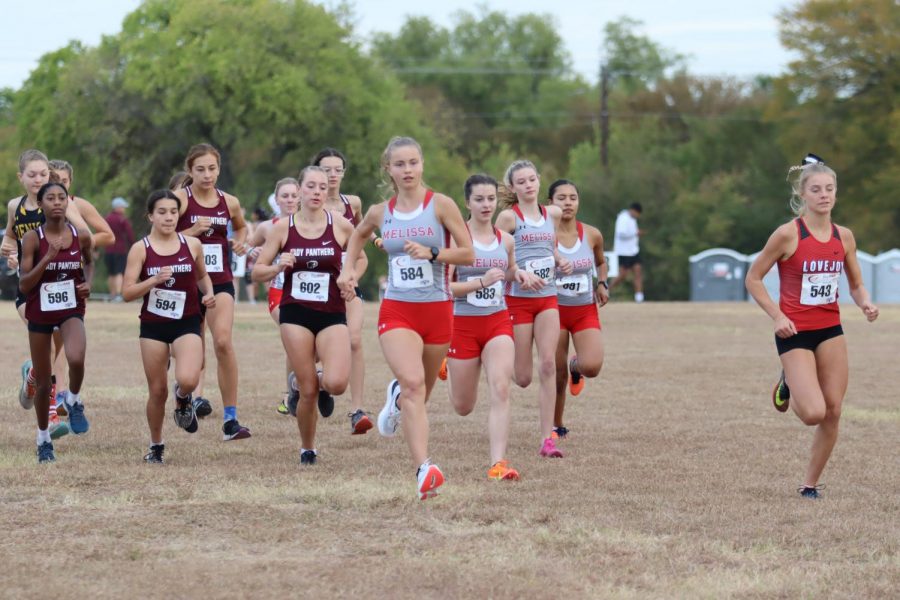 Senior Abi Bass sets the pace early in the 5A District 13 meet held Oct. 11 at Myers Park in McKinney. Bass finished in second place and led her team to qualify for regionals with a third place finish.