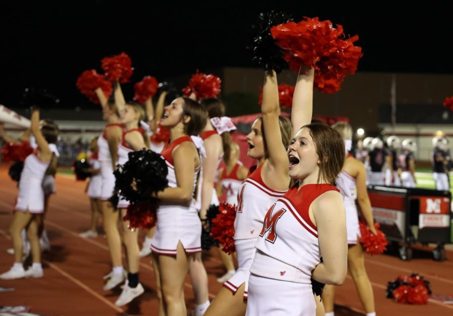 Varsity cheer leads the crowd on the sidelines at a home football game. The UIL Competition Team will host a community performance and state send off on Jan. 10. They will compete at the Spirit State Championship on Jan. 13-14.