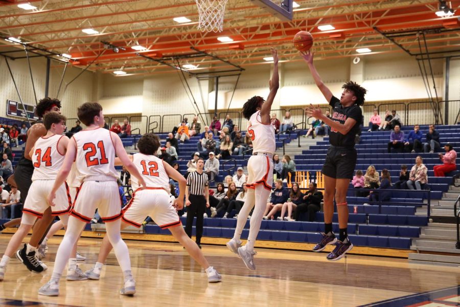 Freshman Austin Goosby shoots the ball in the district game at McKinney North High School on Feb. 7.