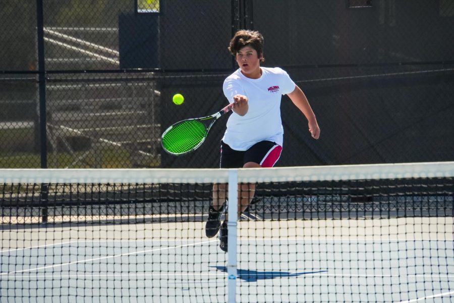 Sophomore Joe Stock competes in boys singles at the varsity district tournament on March 28 held at the Z-Plex.
