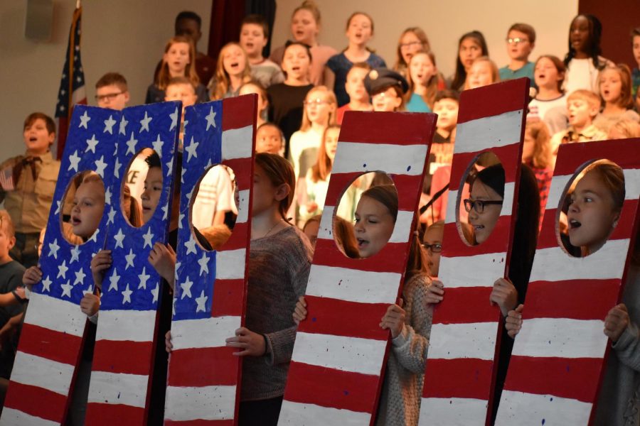 Fifth grade students perform God Bless America at their HME veterans day concert.