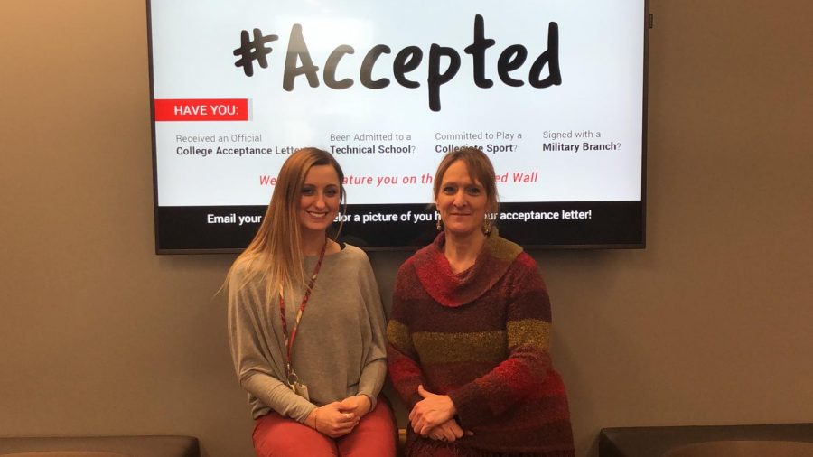 Counselors Ms. Gracy and Mrs. Chapman in front of the #accepted wall