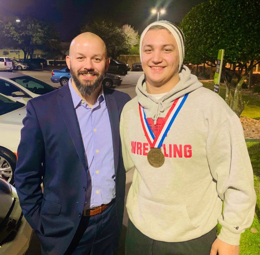 Coach Kiefer and Haden Nofziger pose for a picture with Hadens state medal.