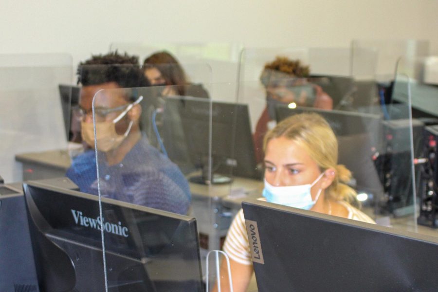 Students return to in-person learning at the high school with a few changes--masks, social distancing when possible, sanitizing and plexiglass dividers in computer labs. 