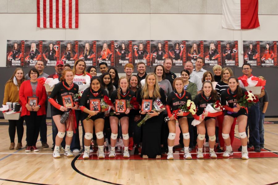 Varsity volleyball seniors and their parents receive recognition on Oct. 23 following their victory over Van Alstyne.