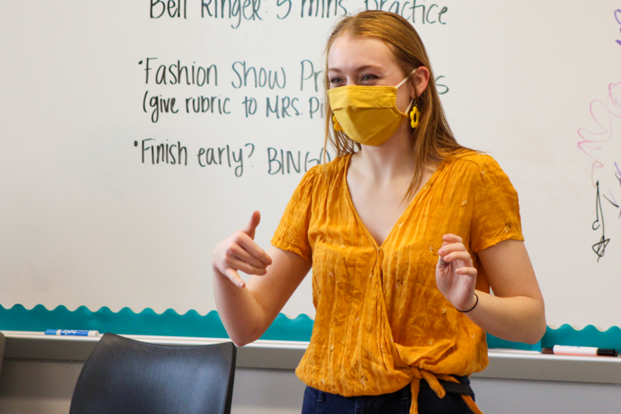Students sign fashion show presentations in American Sign Language (ASL) classes.