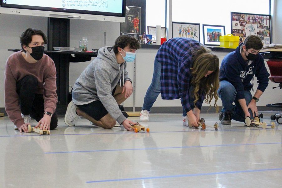 Students in Coach Avilas 4th period physics class prepare to launch their homemade racecars.