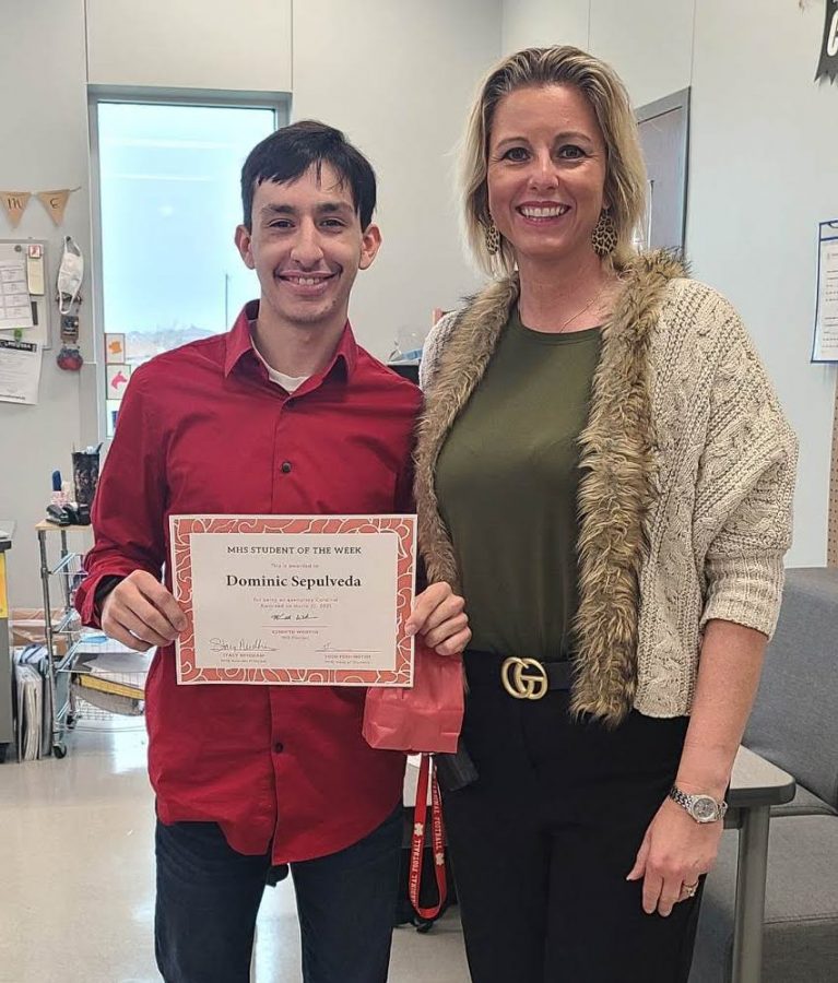 Asst. Principal Needham presents Dominic Sepulveda with the student Cardinal of the Week Award.