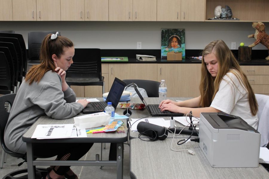 Senior journalists Brianne Finnell and London Tegerdine compose their news writing entries during the district meet. London placed 3rd, qualifying for regionals, and Brianne placed 4th.