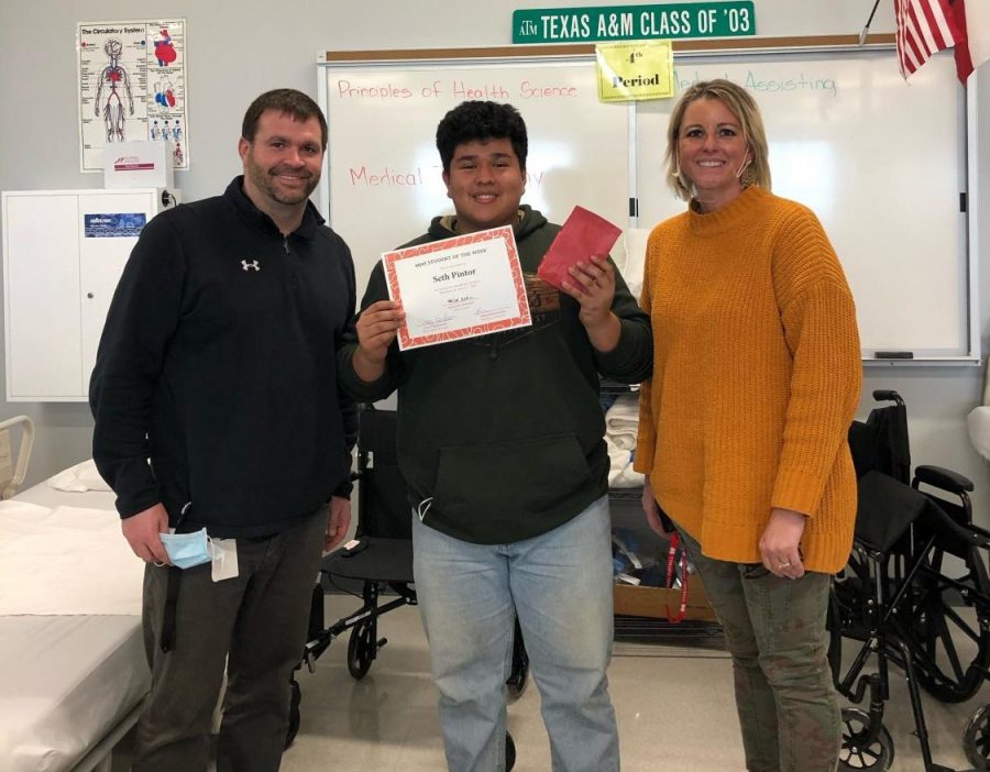 Junior Seth Pintor, pictured with Asst. Principal Stacy Needham and Academic Dean of Students Todd Pennington, is recognized as Cardinal of the Week.