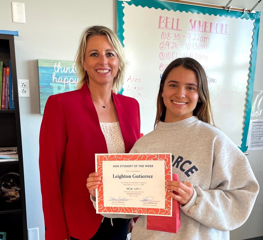 Asst. Principal Stacy Needham presents the Student of the Week award to soph. Leighton Gutierrez.