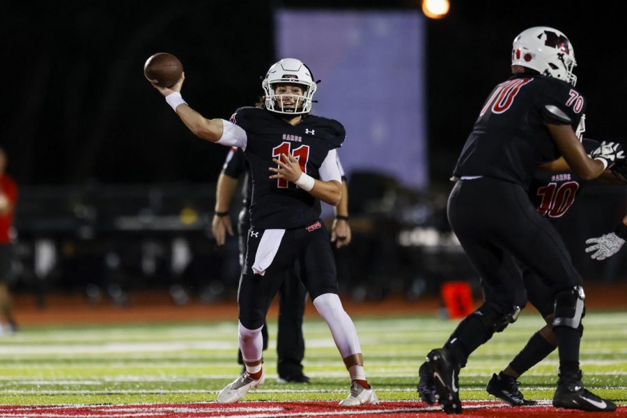 Melissa Cardinals quarterback Sam Fennegan (11) passes for a first down during the Melissa Cardinals vs Argyle Eagles high school football game at Cardinals Stadium in Melissa, Texas on October 1, 2021. (Photo by Matt Pearce/Buzz Photos)