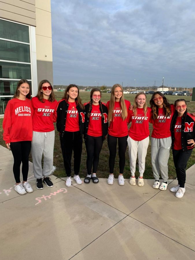 The Cross Country team poses for a photo before leaving for state. This was the first time in nearly a decade that the girls team qualified for the state meet.