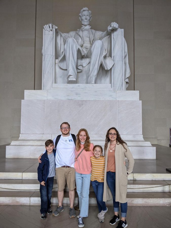 Foreign exchange student Erika Hoiden from Norway poses for a photo in front of the Lincoln Memorial with her host family.