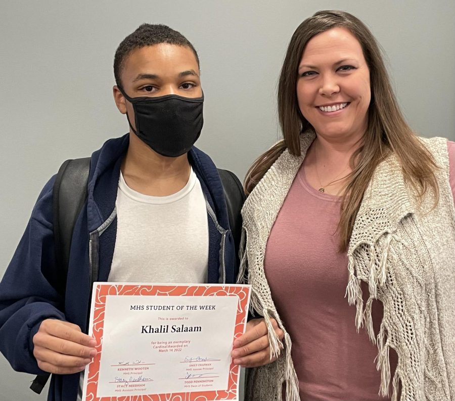 Ms. Slentz presents the Student of the Week award to junior Vincent Thomas.
