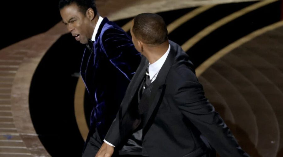 Will Smith slaps comedian Chris Rock after he made a joke about Smiths wife at the 94th Annual Academy Awards.
