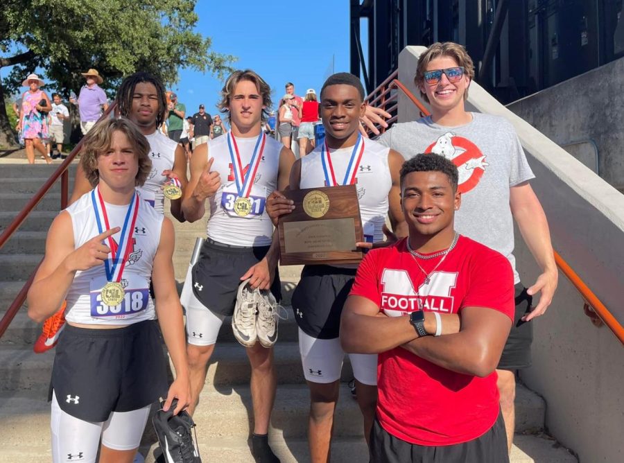 The boys 4 x 100 relay team poses with their gold medals and trophy. The team won the championship in this event at the UIL 4A Track & Field State Meet in Austin on May 12. 