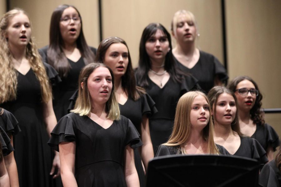 Members of the high school womens chorus perform at their fall concert last school year.