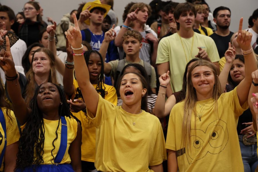 Students close the pep rally with the singing of the school song.