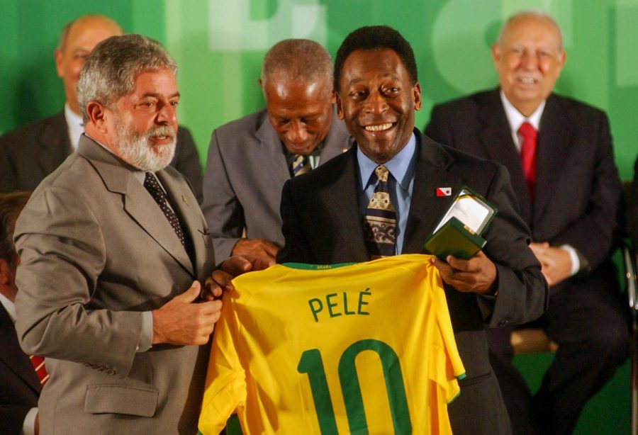 Brazilian President Lula and former soccer player Pelé pose for a photo during the celebration of the 50th anniversary of the first World Cup title won by Brazil in 1958, at the Planalto Palace.