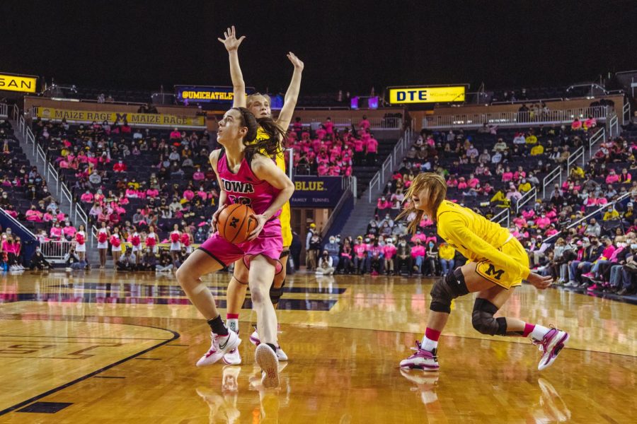 Caitlin Clark goes strong to the rim in a game against Michigan.