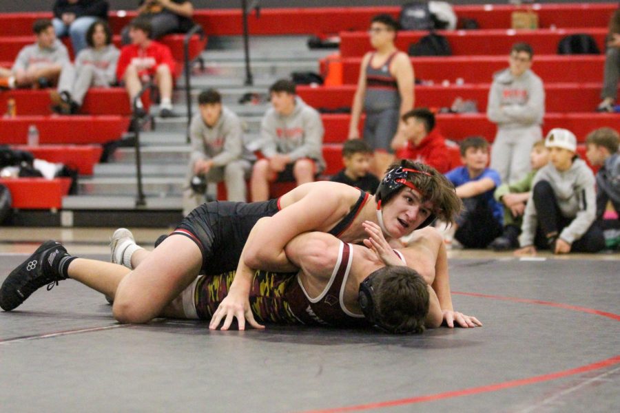 Sophomore Allistair Mohmed wrestles his opponent from Whitesboro at the home duels on Jan. 12. He won the match 11-2.