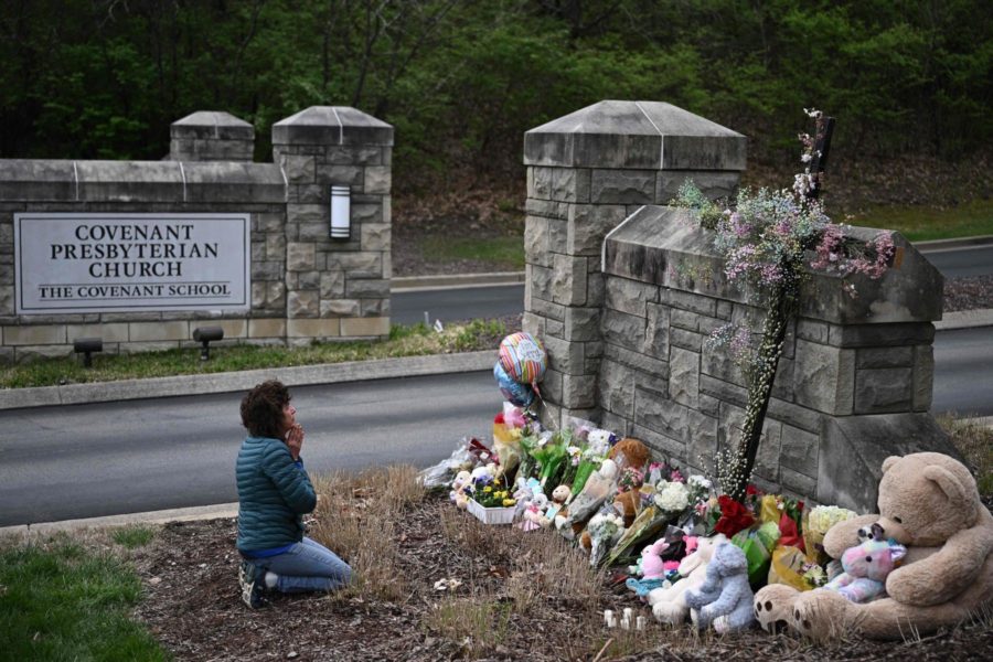 A+resident+of+Nashville+pays+her+respect+to+the+memorial+outside+the+Covenant+School.+Six+individuals+lost+their+lives+in+s+mass+shooting+on+March+27.