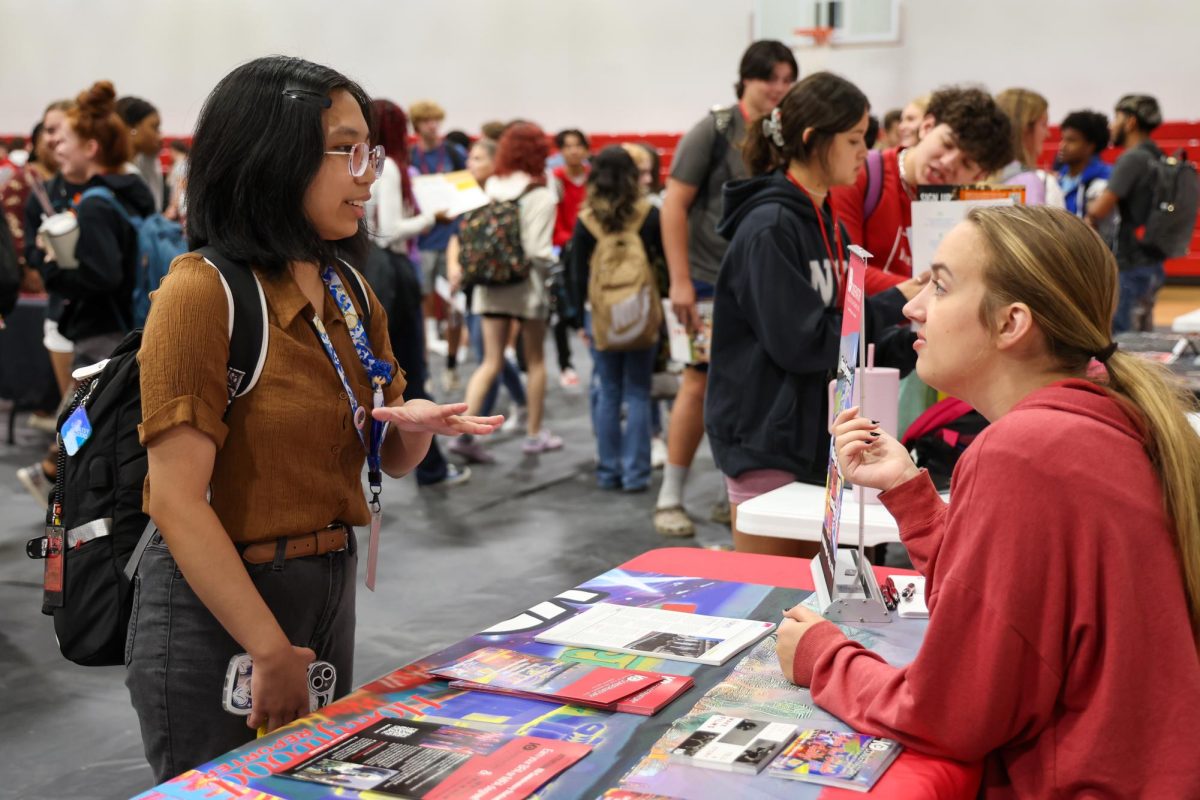 Juniors and seniors visit different booths for colleges and the military at the College Fair held on campus Sept. 14.