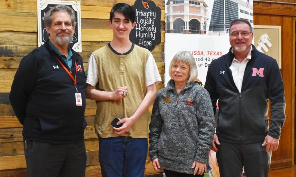 Senior Tyler Mathieson receives his state SkillsUSA champion ring at the November school board meeting. Pictured with Mathieson are his coach Doug Bingman, CTE director Debi Crawford and former high school principal Kenneth Wooten.