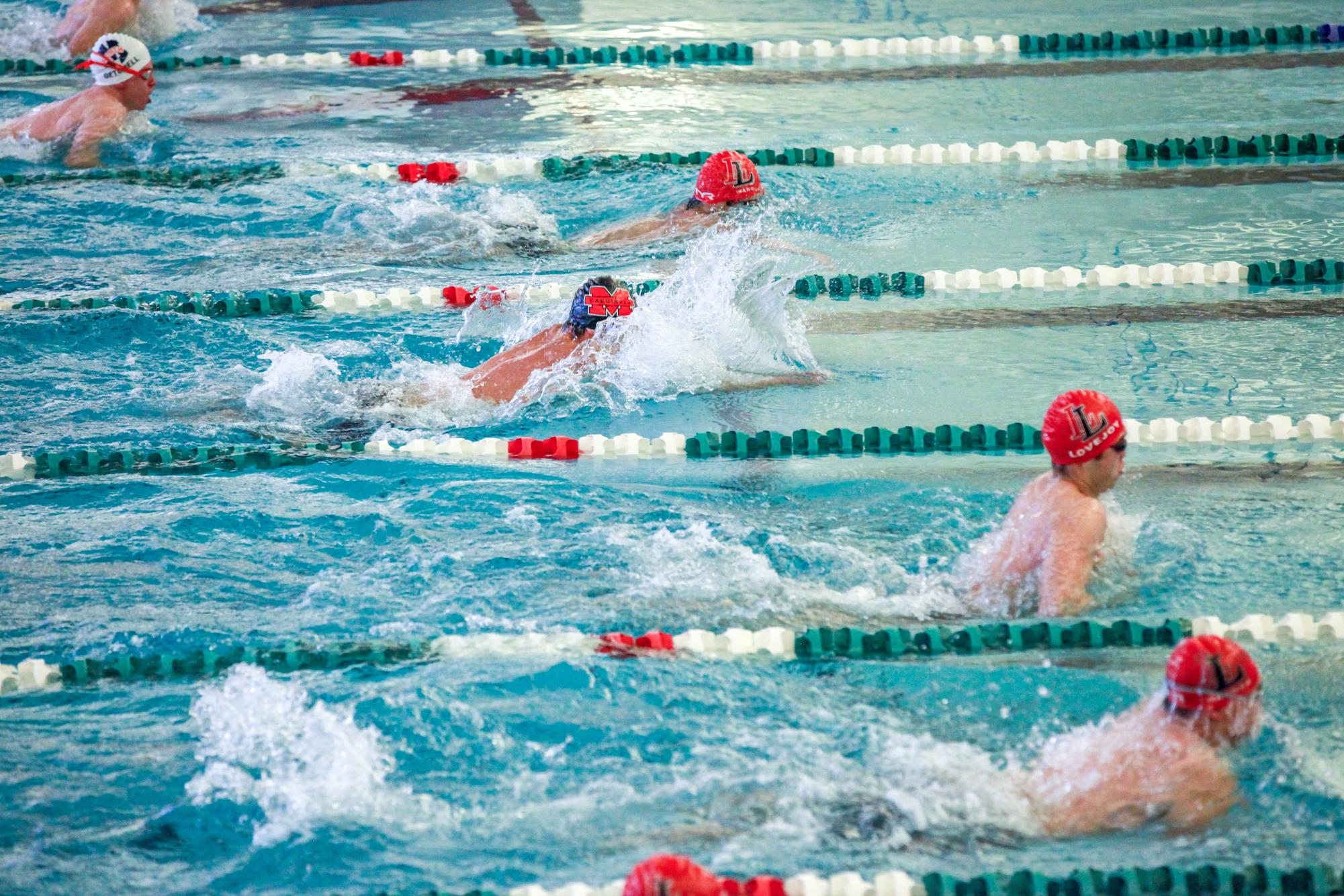 MHS Cardinals Swimmers Shine at 5A District Meet and Secure Spots at UIL Regionals