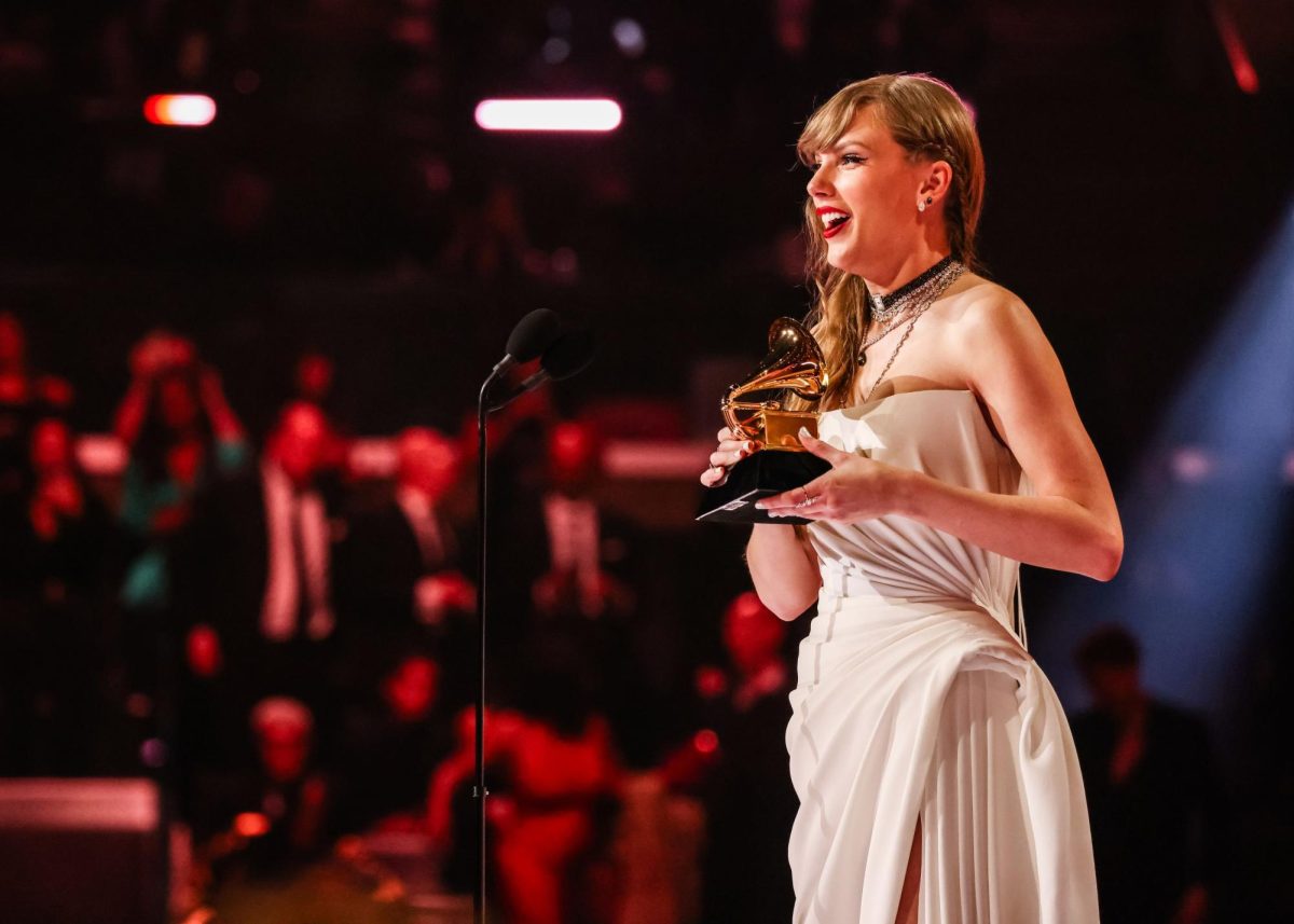 Singer Taylor Swift accepts the album of the year Grammy for Midnights.