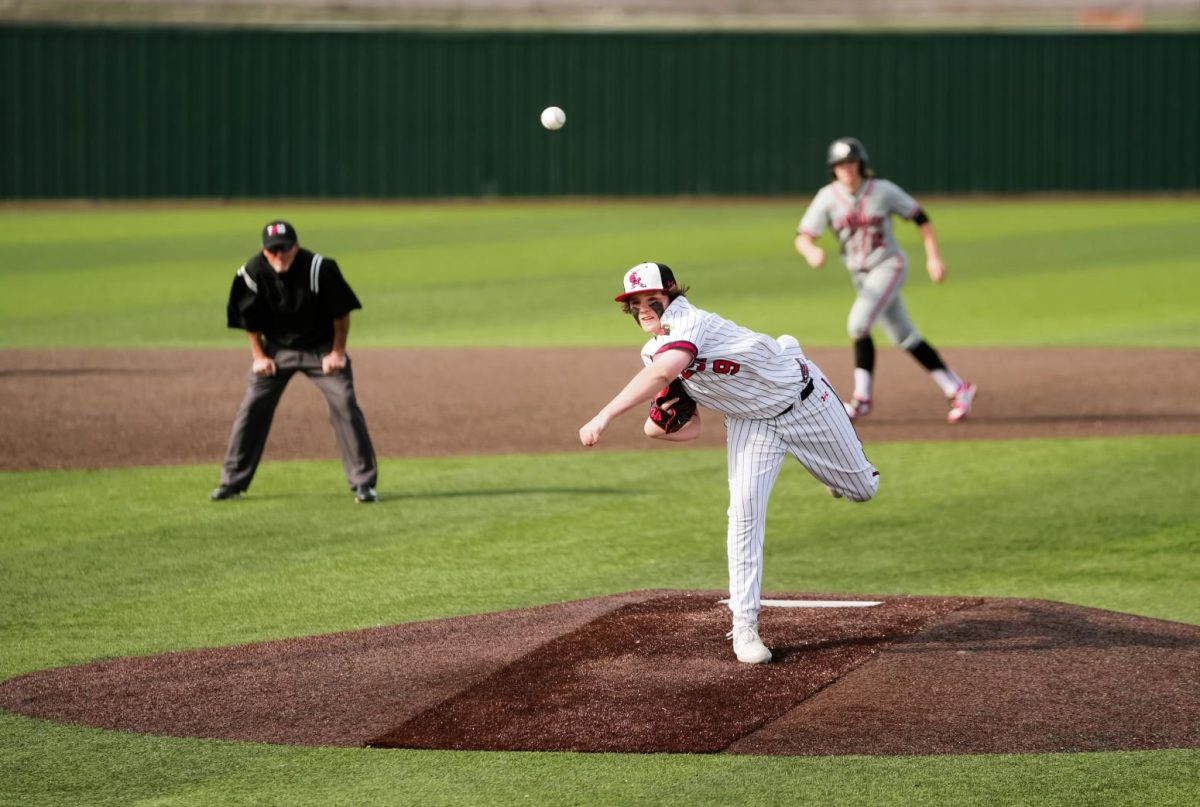 Sophomore Cooper Holbrook pitches from the mound during the game against Lovejoy on March 12.