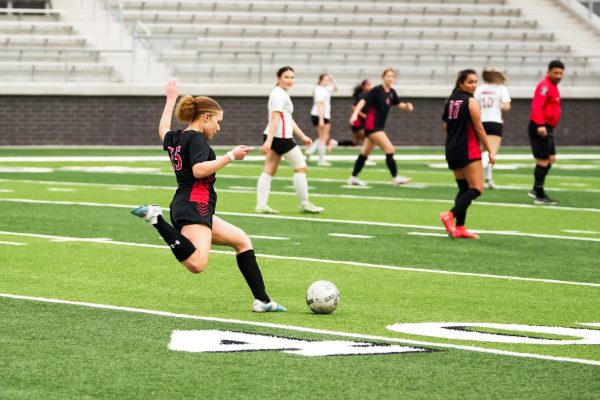 Sophomore Kamya McGregor prepares to kick the ball during the home match against Greenville on Feb. 27. 