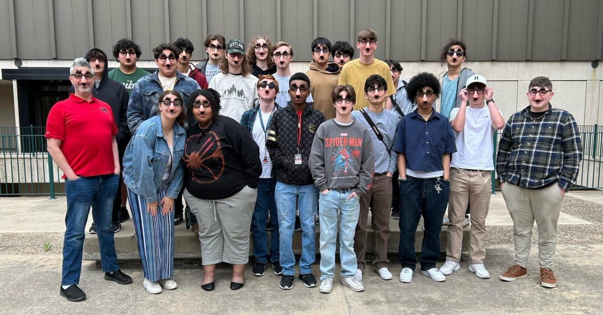 The AV Production Team poses for a group photo while attending the UIL Young Filmmakers State Competition in August in March.