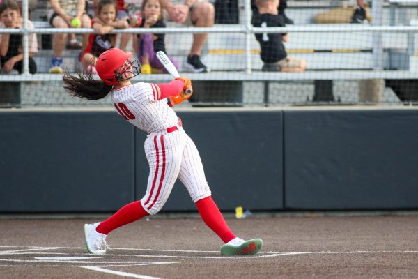 Junior Paisley Needham sends one to the outfield in a home game on April 5. The Lady Cards defeated Wakeland on May 16 in the regional semi-finals to advance to the next round of state playoffs.