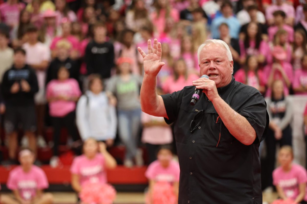 Duke Sparks, Director of Community Partnerships & Athletic Operations, gives a motivational speech at a pep rally. 