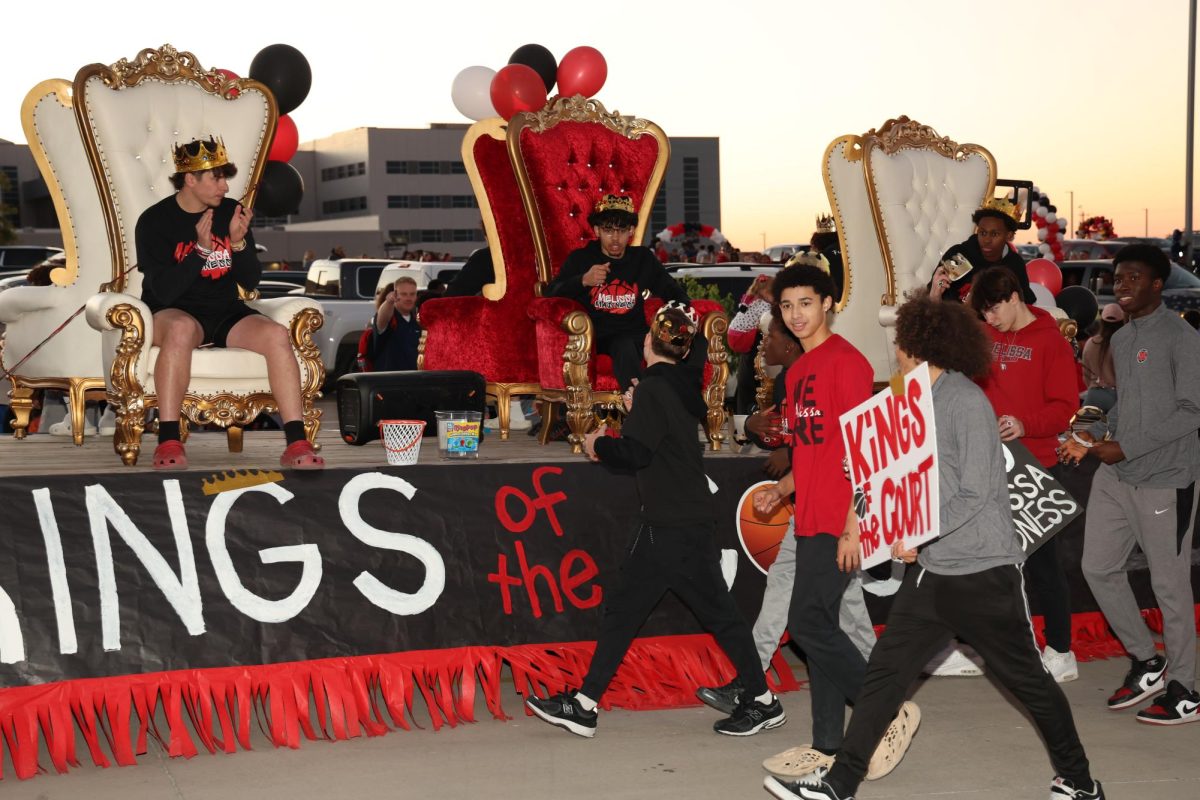 The varsity boys basketball float, "Kings of the Court," wins first place in the annual homecoming parade on Oct. 16.