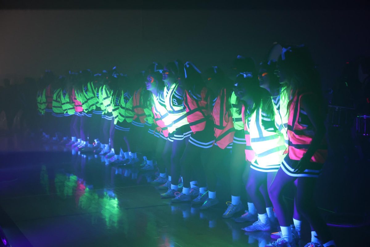 The varsity cheerleaders do the "Big Boom" at the black out pep rally on Oct. 31. Students gathered to celebrate Halloween and to get pumped for the home varsity football game against Walnut Grove on Nov. 1.