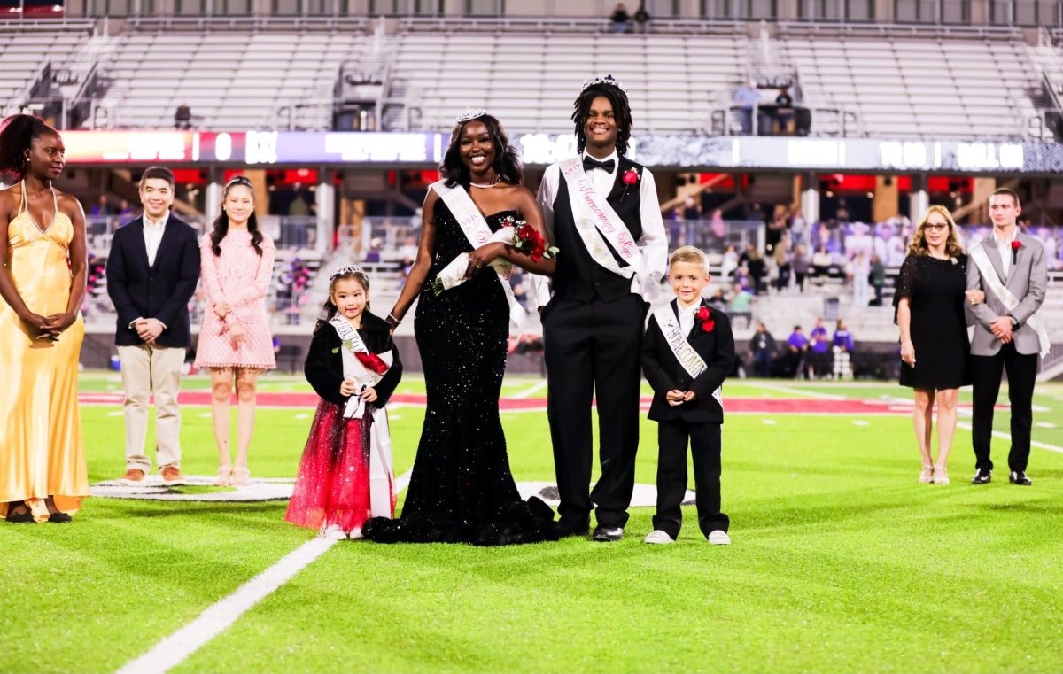 Seniors Rennice Kerebi and Kaden Isowe are crowned as the 2024 Homecoming Queen & King before the varsity football game on Oct. 18. The Cardinals defeated Frisco Independence, 75-6.