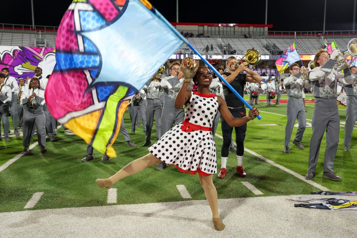 The band performs their comic-themed marching show during halftime of the homecoming football game against Frisco Independence on Oct. 18.