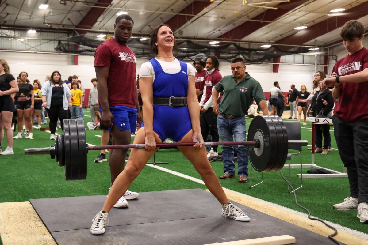 Senior Paisley Needham maxes out on deadlift at the powerlifting meet held Jan. 16 at Sherman High School.