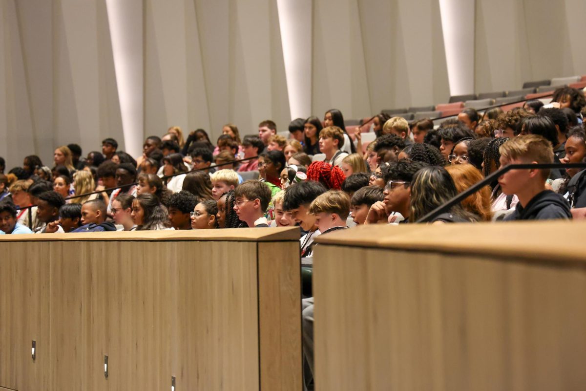 Freshman students listen to Principal Marcus Eckert during their class meeting in the Melissa Arts Center on August 22.