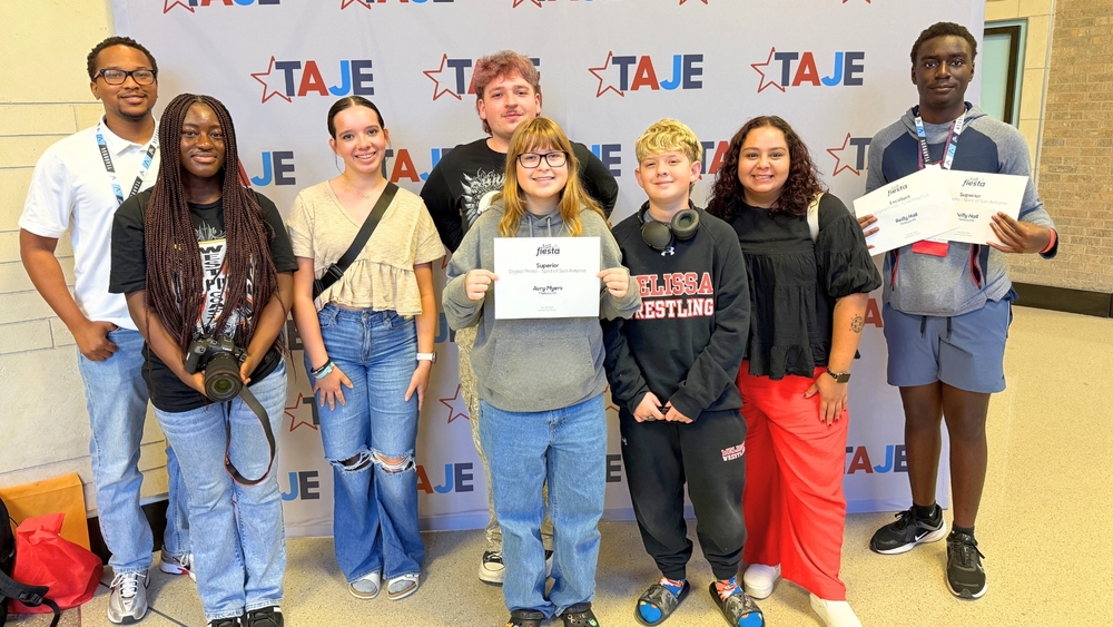 Cardinal Student Media members show their awards at the close of the TAJE Fall Fiesta state conference.